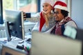 Working at holiday at office. People work at Christmas and  take selfie in santa hat Royalty Free Stock Photo