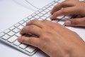 Working at home with laptop men writing a blog. Typing on a keyboard. Programmer or computer hacker Royalty Free Stock Photo