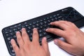 Working at home with laptop men writing a blog. Typing on a keyboard. Programmer or computer hacker Royalty Free Stock Photo