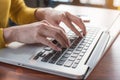 Working at home with laptop woman writing a blog. Female hands o Royalty Free Stock Photo