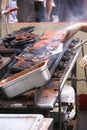 Working a hot grill at Seattle   Street Fair Royalty Free Stock Photo