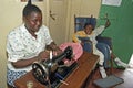 Working Kenyan woman with disabled child, Nairobi