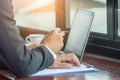 Working on laptop, close up of hands of business man Royalty Free Stock Photo