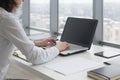 Working with laptop woman writing a blog. Female hands on the keyboard. Royalty Free Stock Photo