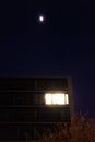 Working late: single illuminated office at night