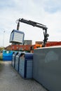 Working machine heaving container for separated waste in order to empty it