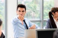 Working man show thumb down with group of people in metting room, focus on hand , bad concept Royalty Free Stock Photo