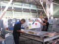 Working man specialist collects aircraft parts at the aircraft factory Chkalov Novosibirsk