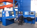 Working specialist male operator works at the control panel at the plant in the shop