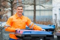 Working Man Standing Near Dustbin On Street Royalty Free Stock Photo