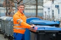 Working Man Standing Near Dustbin On Street Royalty Free Stock Photo