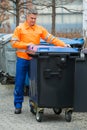 Working Man Standing Near Dustbin On Street Royalty Free Stock Photo