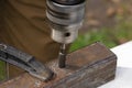 Working with metal. Men's hands with a drill Royalty Free Stock Photo