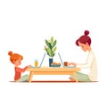 Working mother works from home office with kid. Freelancer workplace with laptop and the Internet. People at home work