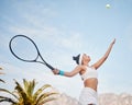 Working on my serve today. young tennis player standing alone on the court and serving the ball during practice. Royalty Free Stock Photo