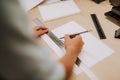 Young lady preparing to draw straight line on blank paper Royalty Free Stock Photo