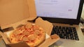 Working office with a tasty pizza