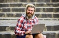 Working online. Hipster inspired work in urban space. Modern laptop. Remote job. When deadline coming. Fresh air. Mobile Royalty Free Stock Photo