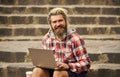 Working online. Hipster inspired work in urban space. Modern laptop. Remote job. When deadline coming. Fresh air. Mobile Royalty Free Stock Photo