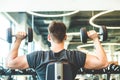 Working out with dumbbell weights at the gym.Fitness men exercising are lifting dumbbells. Fitness muscular body Royalty Free Stock Photo