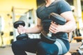 Working out with dumbbell weights at the gym.Fitness men exercising are lifting dumbbells. Fitness muscular body Royalty Free Stock Photo