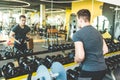 Working out with dumbbell weights at the gym.Fitness men exercising are lifting dumbbells. Fitness muscular body Royalty Free Stock Photo