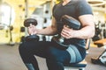 Working out with dumbbell weights at the gym.Fitness men exercising are lifting dumbbells. Fitness muscular body Royalty Free Stock Photo