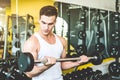 Working out with dumbbell weights at the gym.Fitness men exercising are lifting dumbbells. Fitness muscular body Royalty Free Stock Photo