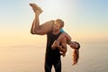 Working out together will make you and your relationship stronger. a sporty couple being playful while out for a workout