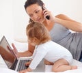 Working, phone call and mom with baby on laptop multitasking in home. Infant, kid and mother busy with computer and Royalty Free Stock Photo