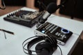 Working place of radio host. Close up of headphones, microphone and sound mixing desk on the table in recording studio Royalty Free Stock Photo