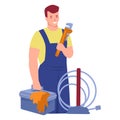A working plumber with an adjustable wrench and a box of tools. Vector illustration in flat cartoon style. Isolated on a white Royalty Free Stock Photo