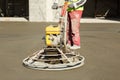 Working power trowel machine on a fresh concrete surface Royalty Free Stock Photo