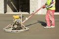 Working power trowel machine on a fresh concrete surface Royalty Free Stock Photo