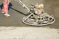 Working power trowel machine on a fresh concrete surface Royalty Free Stock Photo