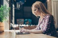 Working process concept. Young, business woman sitting in workstation, using portable computer device in the office Royalty Free Stock Photo