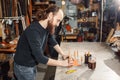 Working process in the leather workshop. Tanner in old tannery.