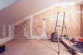 Working process of renovate room with installing drywall or gypsum plasterboard and ladder with construction materials Royalty Free Stock Photo