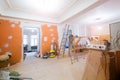 Working process of renovate room with installing drywall or gypsum plasterboard and ladder with construction materials Royalty Free Stock Photo