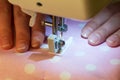 Working process of seamstress, detail of sewing machine closeup Royalty Free Stock Photo