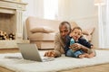 Concentrated man working and hugging his son Royalty Free Stock Photo