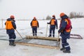 Sailors work at the lane with a fenced wooden formwork Royalty Free Stock Photo