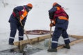 Sailors work at the lane with a fenced wooden formwork Royalty Free Stock Photo