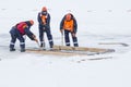 Sailors work at the lane with a fenced wooden formwork Royalty Free Stock Photo