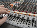 Working on a recording studio mixing board Royalty Free Stock Photo