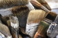 Working set of paint brushes from natural bristles with layering of paint from multiple use