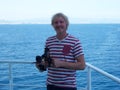 Working with sextant on board of merchant vessel near the coast