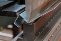 working with sheet metal on CNC hydraulic press brake. Bending sheet metal Royalty Free Stock Photo