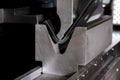 working with sheet metal on CNC hydraulic press brake. Bending sheet metal Royalty Free Stock Photo