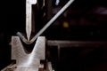 Working with sheet metal on CNC hydraulic press brake. Bending sheet metal Royalty Free Stock Photo